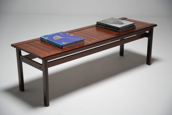 A slatted rosewood coffee table. 8